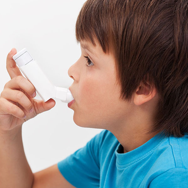 A child with an inhaler