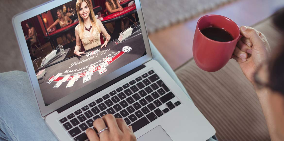 live dealer casino play at laptop